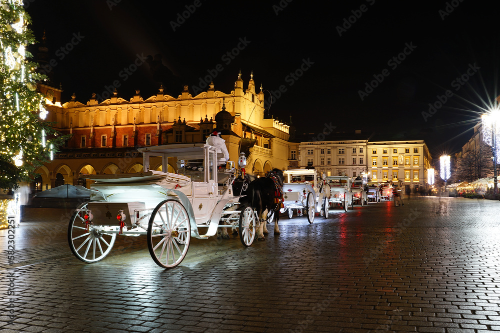 The magic of Krakow's market. Cab lights visible.
