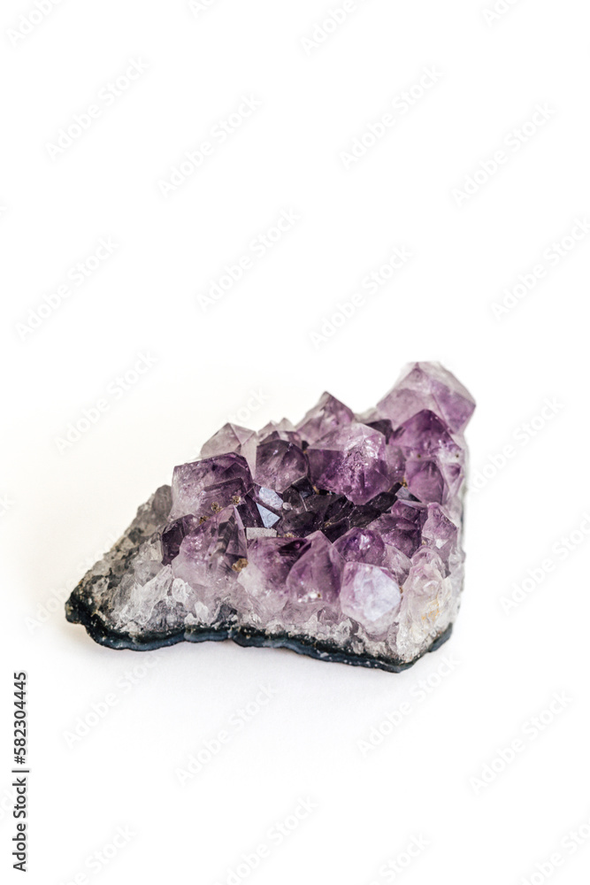 purple amethyst geode rock on white