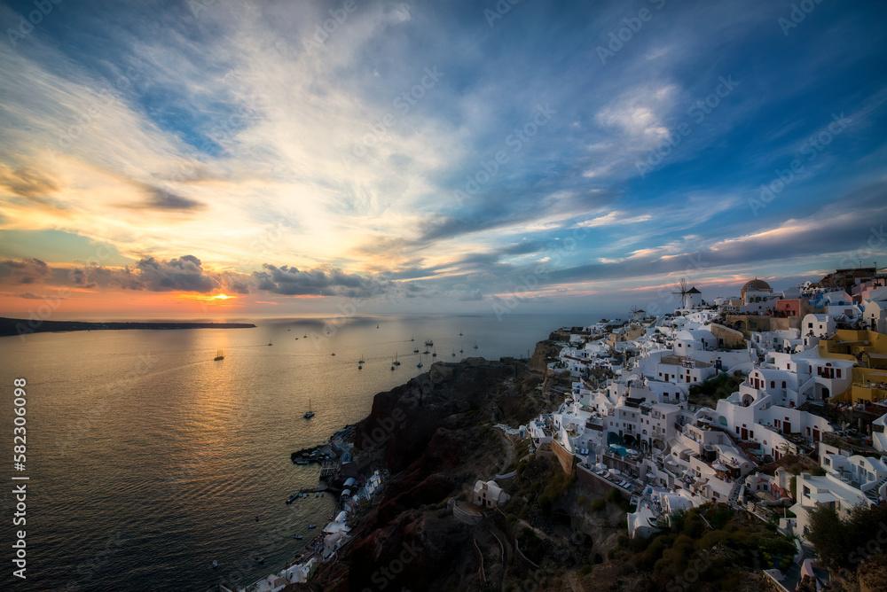 Boats with People Gathering to Experience the Famous Sunset at the Beautiful Village of Oia on Santorini, Greece