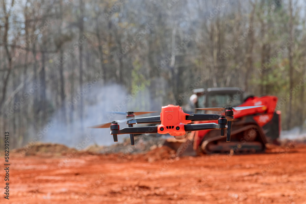 An experienced engineer architect checks construction process on site using a drone An experienced engineer architect checks construction process on site using a drone