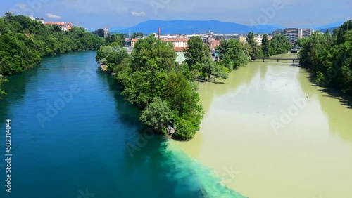 Famous La Jonction, the joint and confluence of rivers Rhone on the left and Arve on the right in Geneva, Switzerland.