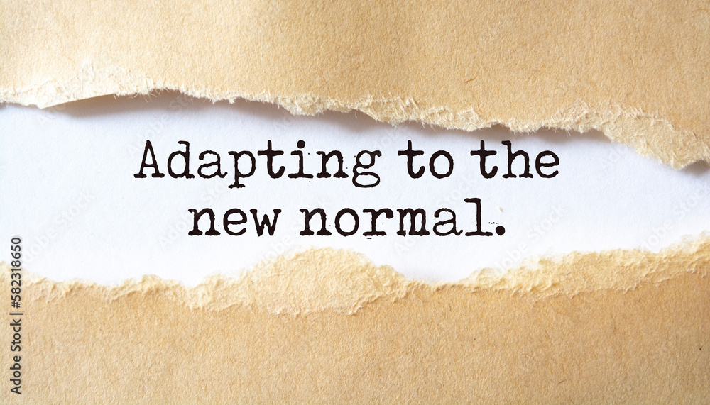 Adapting to the new normal. Words written under torn paper. Stock Photo ...