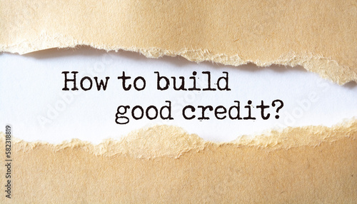 How to build good credit?. Words written under torn paper.