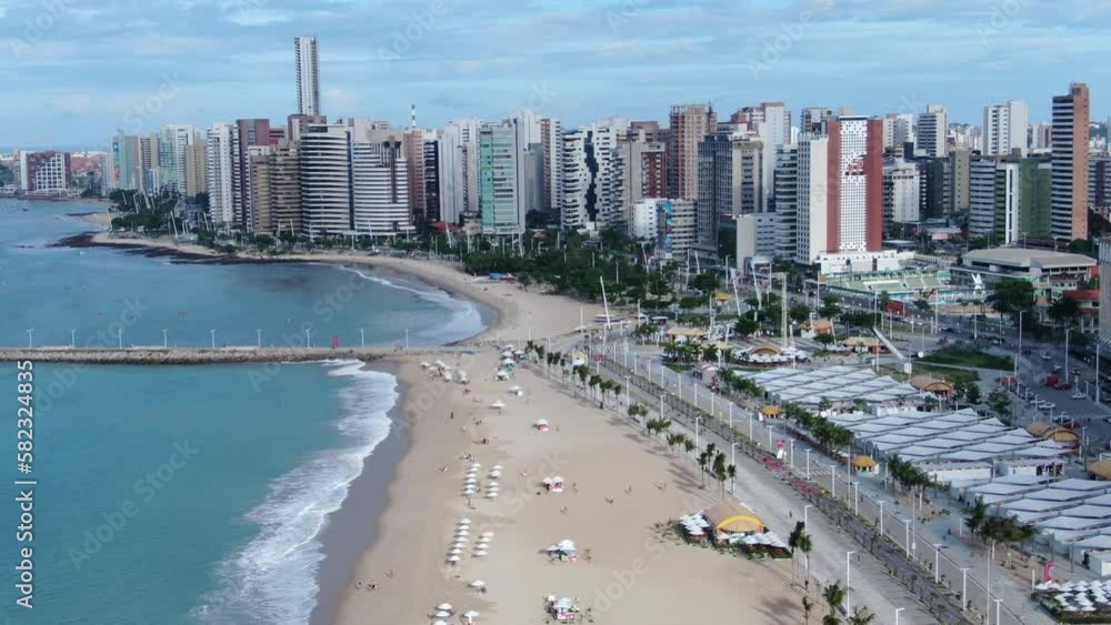 Beira Mar de Fortaleza. Fortaleza city, Brazil. Flying towards beach with Hotels and Resorts Backdrop beach drone footage. Skyline of Fortaleza city from ocean, Ceara State, Brazil Beira Mar de Fortaleza. Fortaleza city, Brazil. Flying towards beach with Hotels and Resorts Backdrop beach drone footage. Skyline of Fortaleza city from ocean, Ceara State, Brazil