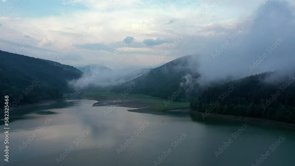 Lake in the mountains and coniferous forest Lake in the mountains and coniferous forest