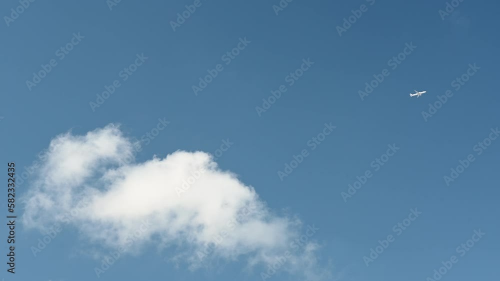 White small airplane in blue sky with cloud White small airplane in blue sky with cloud