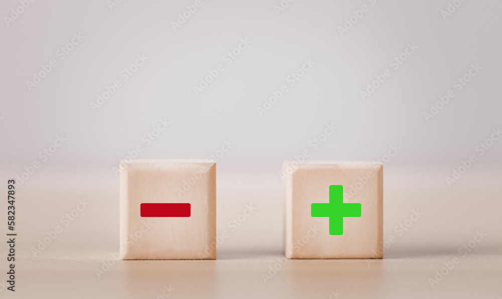 Wooden blocks showing plus and minus signs. The concept of antithesis. Decision making. Positive or negative business choice. Analysis of advantages and disadvantages Comparison Wooden blocks showing plus and minus signs. The concept of antithesis. Decision making. Positive or negative business choice. Analysis of advantages and disadvantages Comparison