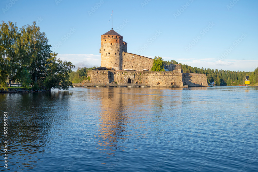 View of the ancient fortress of Olavinlinna (St. Olaf) on a sunny August evening. Savonlina, Finland