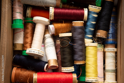 Spools of sewing threads of different colors