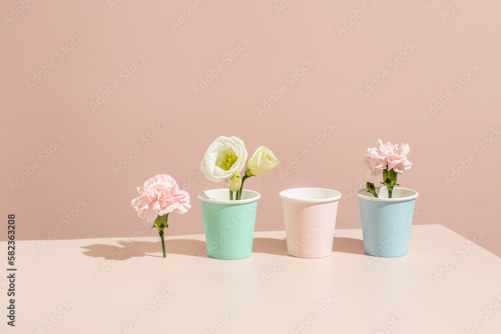 Eco-friendly paper mockup coffee cups on a beige background.