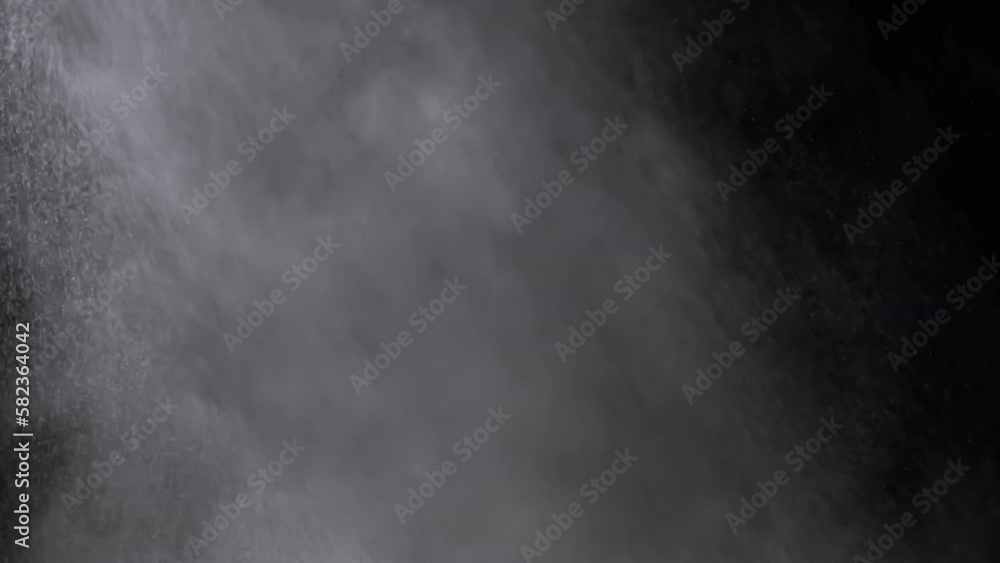 Explosion of Mixed Particles of Water Vapor Smoke Isolated on Black Background. Icy cloud of steam, smoke, gas, water drops explode, mix, swirl in the whirlpool of a storm, a hurricane, or tsunami. Explosion of Mixed Particles of Water Vapor Smoke Isolated on Black Background. Icy cloud of steam, smoke, gas, water drops explode, mix, swirl in the whirlpool of a storm, a hurricane, or tsunami.