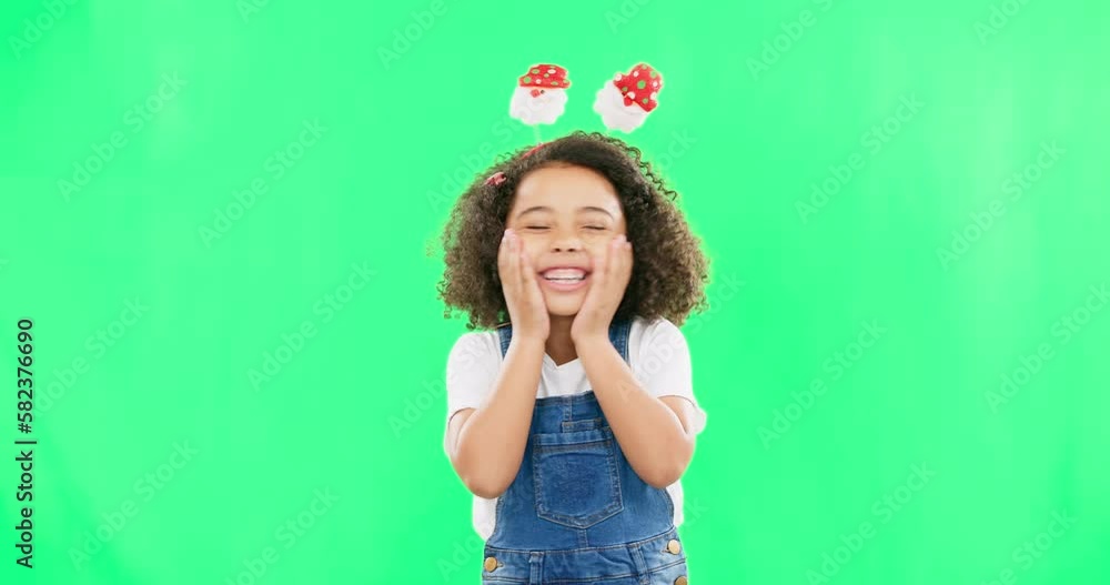 Excited child, green screen and Christmas fun with smile and silly headband ready for celebration. Comic, surprised and youth shocked portrait of a young girl with happiness about holiday event Excited child, green screen and Christmas fun with smile and silly headband ready for celebration. Comic, surprised and youth shocked portrait of a young girl with happiness about holiday event
