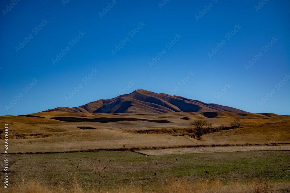 landscape with sky and hills in Kyrgyzstan