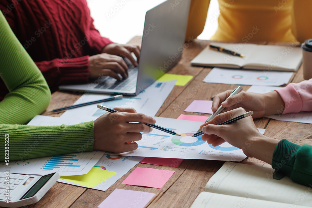 Teamwork with businessman analyzing cost graphs on table at conference room. Teamwork with businessman analyzing cost graphs on table at conference room.