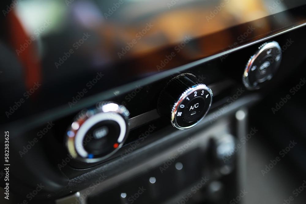 The process of choosing climate control in the car. Various controls in auto switches. Modern car interior