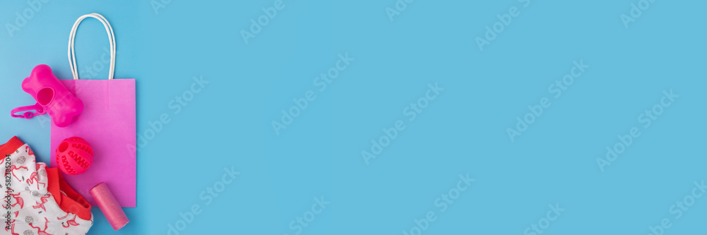 pet shop background, dog and cat goods on a blue background, banner, copy space, top view, flat lay pet shop background, dog and cat goods on a blue background, banner, copy space, top view, flat lay