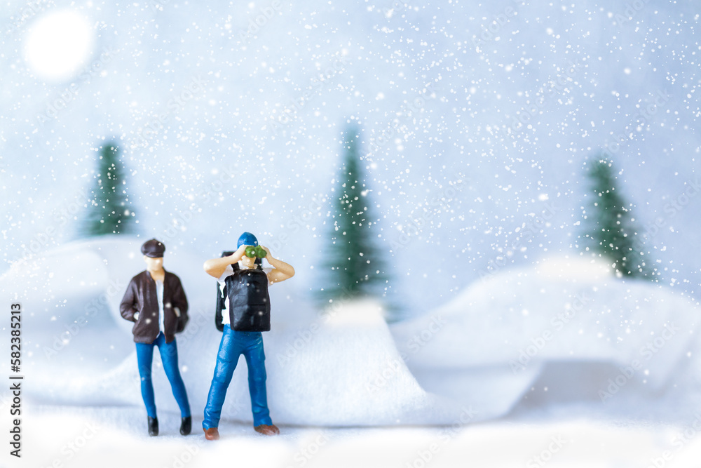 Miniature people Backpacker Travel in winter time