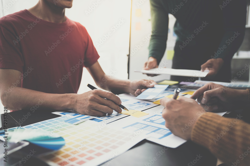 ux-developers-ui-designers-asian-group-data-researchers-brainstorm-on