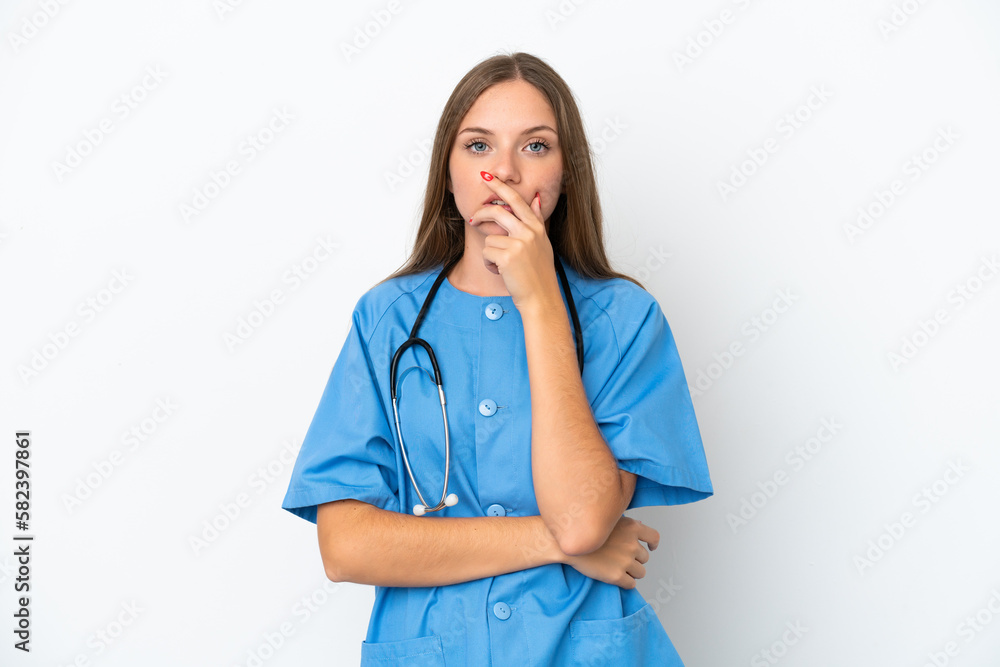 Young surgeon doctor Lithuanian woman isolated on white background surprised and shocked while looking right Young surgeon doctor Lithuanian woman isolated on white background surprised and shocked while looking right