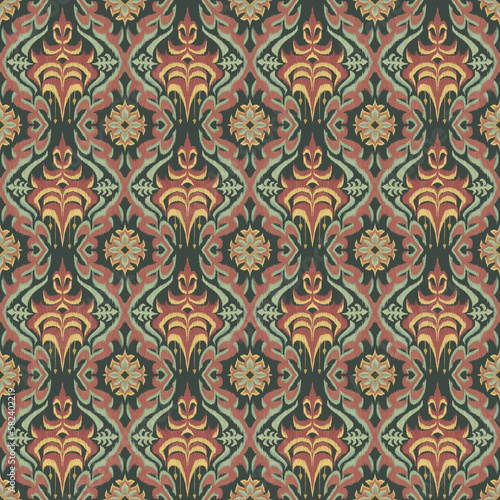 Ikat floral paisley embroidery on green background.geometric ethnic oriental seamless pattern traditional.Aztec style abstract illustration.design for fabric,carpet,clothing,wrapping,decoration.
