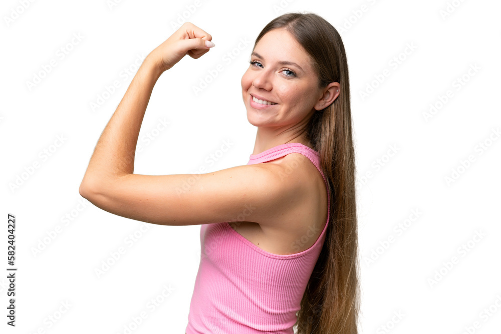Young beautiful blonde woman over isolated background doing strong gesture Young beautiful blonde woman over isolated background doing strong gesture