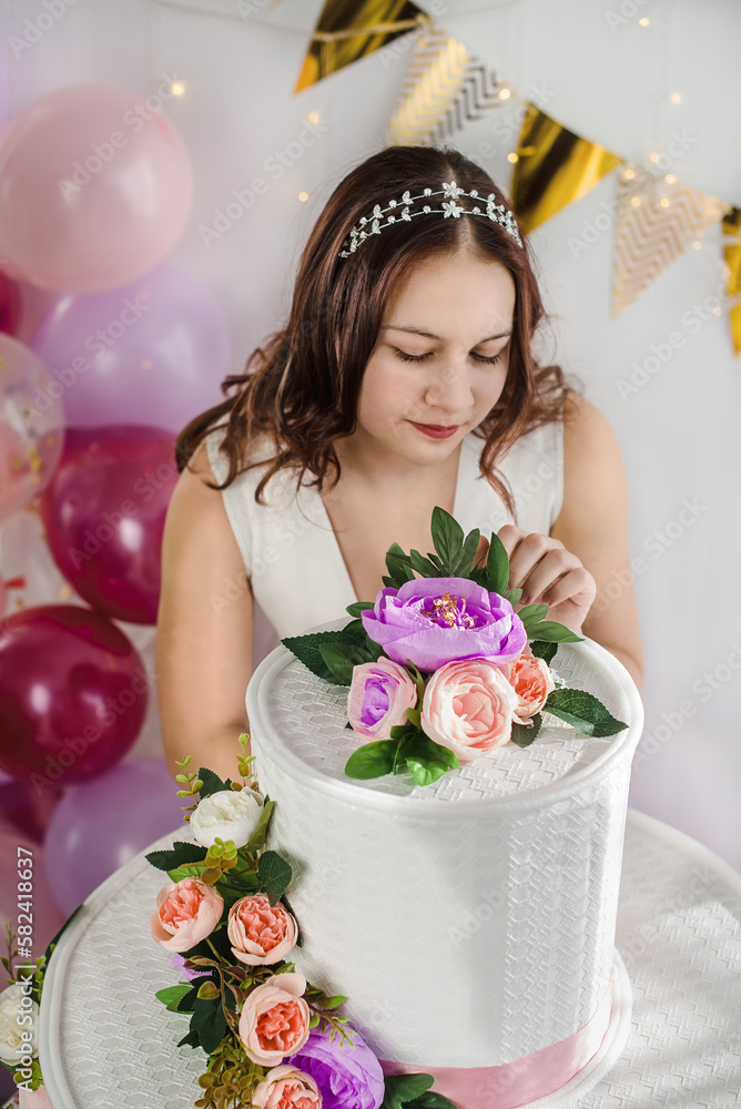 Young teen girl on her birthday with a big cake and balloons Stock ...