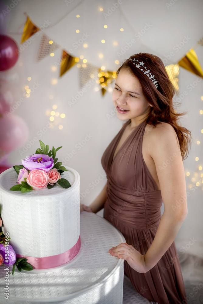 Young teen girl on her birthday with a big cake and balloons Stock ...