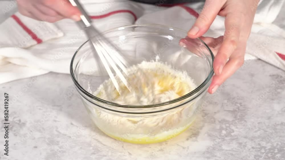 Step by step. Mixing ingredients in a glass mixing bowl to prepare chocolate mug cakes. Step by step. Mixing ingredients in a glass mixing bowl to prepare chocolate mug cakes.