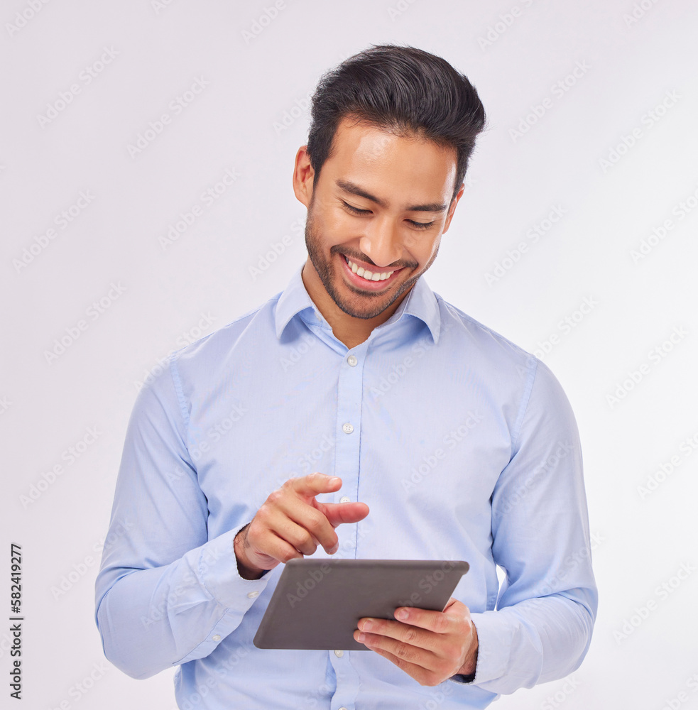 Typing, smile and business man with tablet in studio isolated on a white background. Professional, technology and happy male with touch screen for social media, research or internet browsing online.