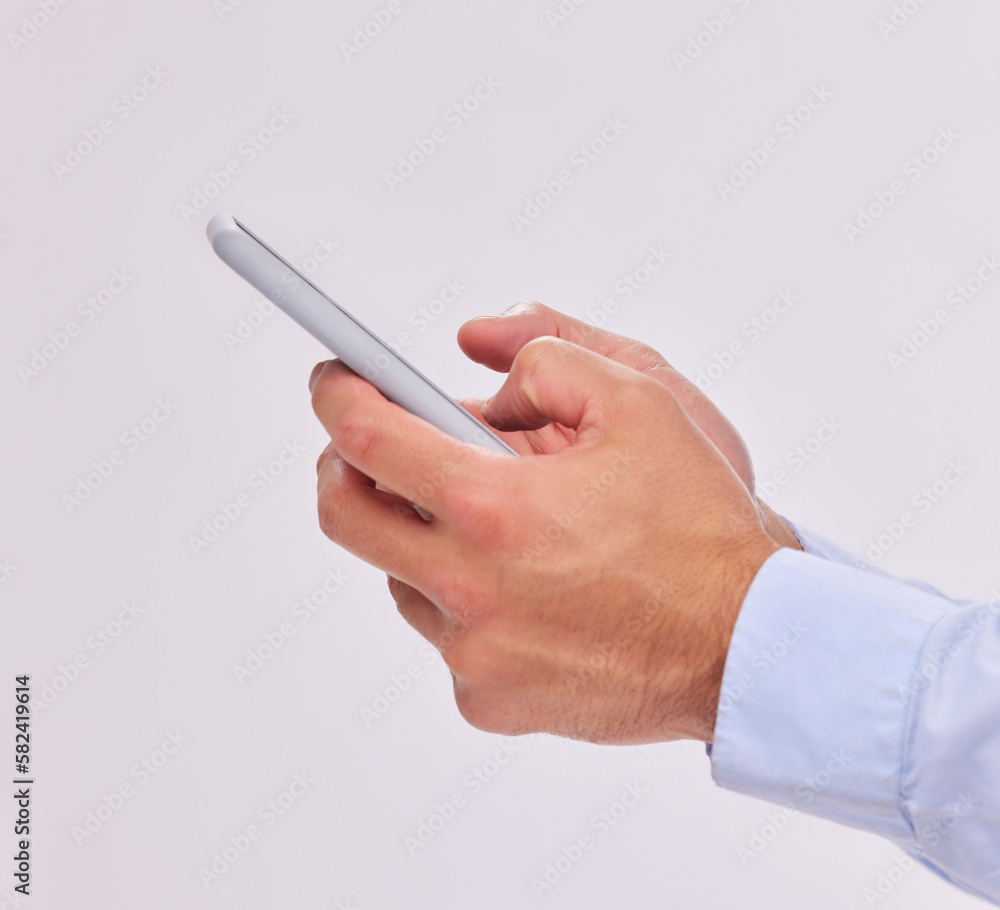 Hands, technology and typing with phone in studio isolated on a white background. Cellphone, networking and male or man with mobile smartphone for texting, social media or internet browsing online Hands, technology and typing with phone in studio isolated on a white background. Cellphone, networking and male or man with mobile smartphone for texting, social media or internet browsing online