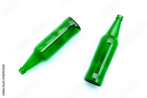 Green glass bottles on white background.