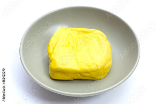 Yellow tofu on white background.