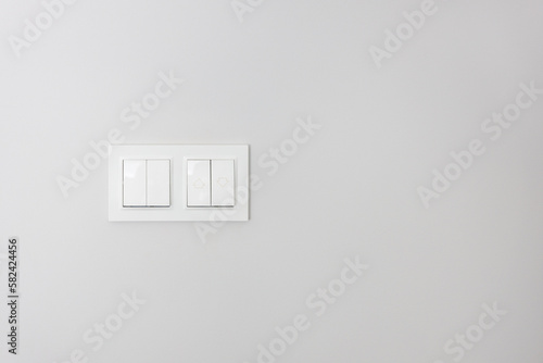 Switches on the wall to the light. a concept that turns on a new way of success technology.
