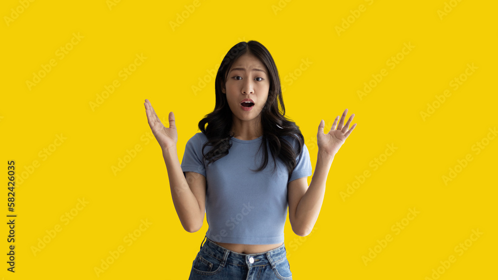 Asian woman acting shocked or surprised isolated on a white background, Looking camera, Concept acts according to the emotions and feelings of excitement and shock, Yellow background, Copy space. Asian woman acting shocked or surprised isolated on a white background, Looking camera, Concept acts according to the emotions and feelings of excitement and shock, Yellow background, Copy space.