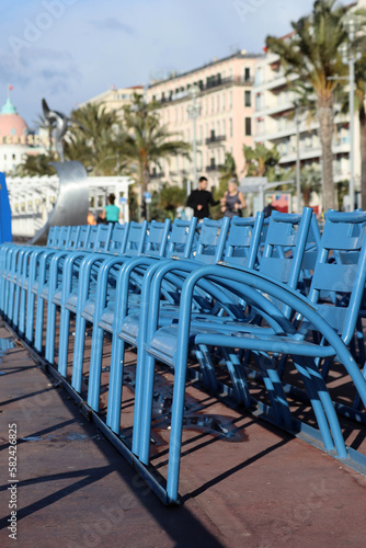 Fototapeta Naklejka Na Ścianę i Meble -  Famous blue chairs on the Promenade des Anglais in Nice