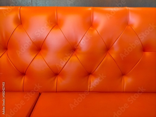 orange leather sofa back background photo