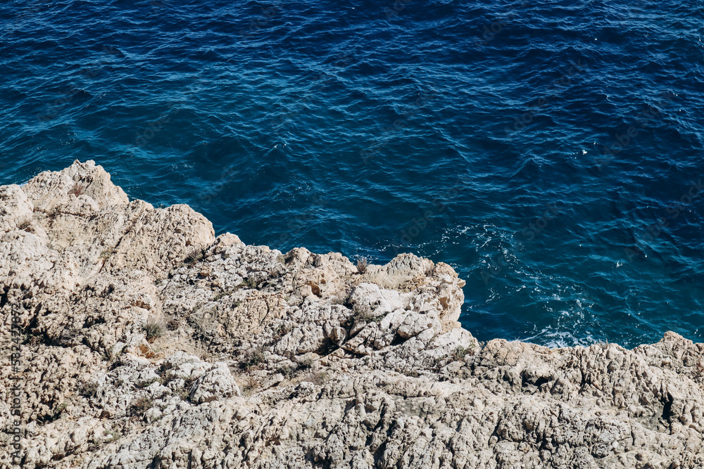 Water's edge on the peninsula of Saint-Jean-Cap-Ferrat on a sunny day Water's edge on the peninsula of Saint-Jean-Cap-Ferrat on a sunny day