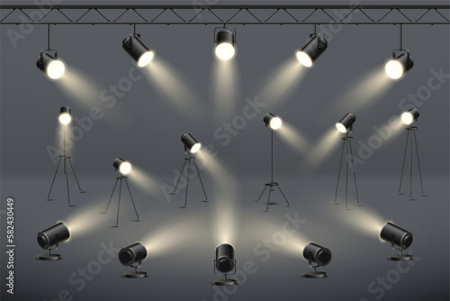 Studio light, stage spotlights, 3d lamps. Concert or movie equipment, photo spot lights hanging and standing, realistic video scene effect, projector illumination. Vector illustration design