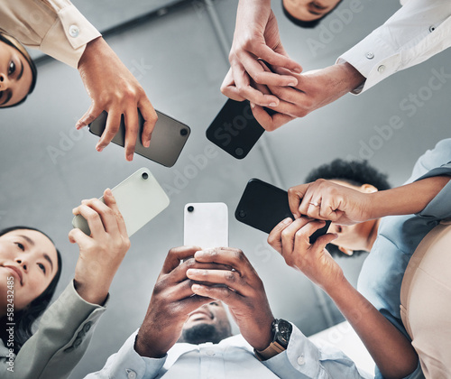 Phone, circle or business people networking on social media searching online news together in low angle. Mobile app technology, digital internet website or group chat community hands typing message