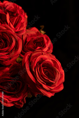 Bouquet of red roses on black background 