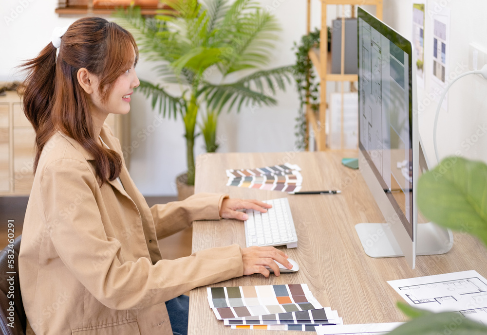 Professional interior designer working in the office, Portrait of young ...