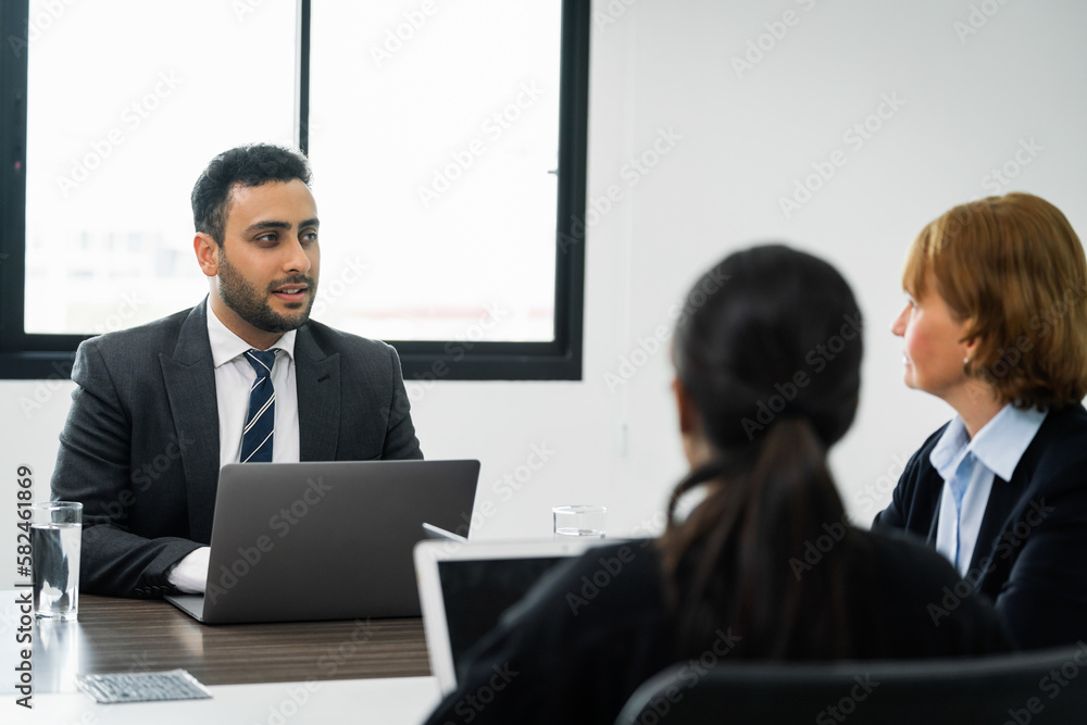 Business people meeting in a conference room to plan for a new project Business people meeting in a conference room to plan for a new project