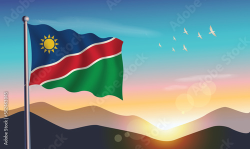 Namibia flag with mountains and morning sun in background