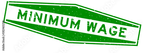 Grunge green minimum wage word hexagon rubber seal stamp on white background photo