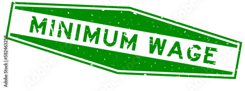 Grunge green minimum wage word hexagon rubber seal stamp on white background