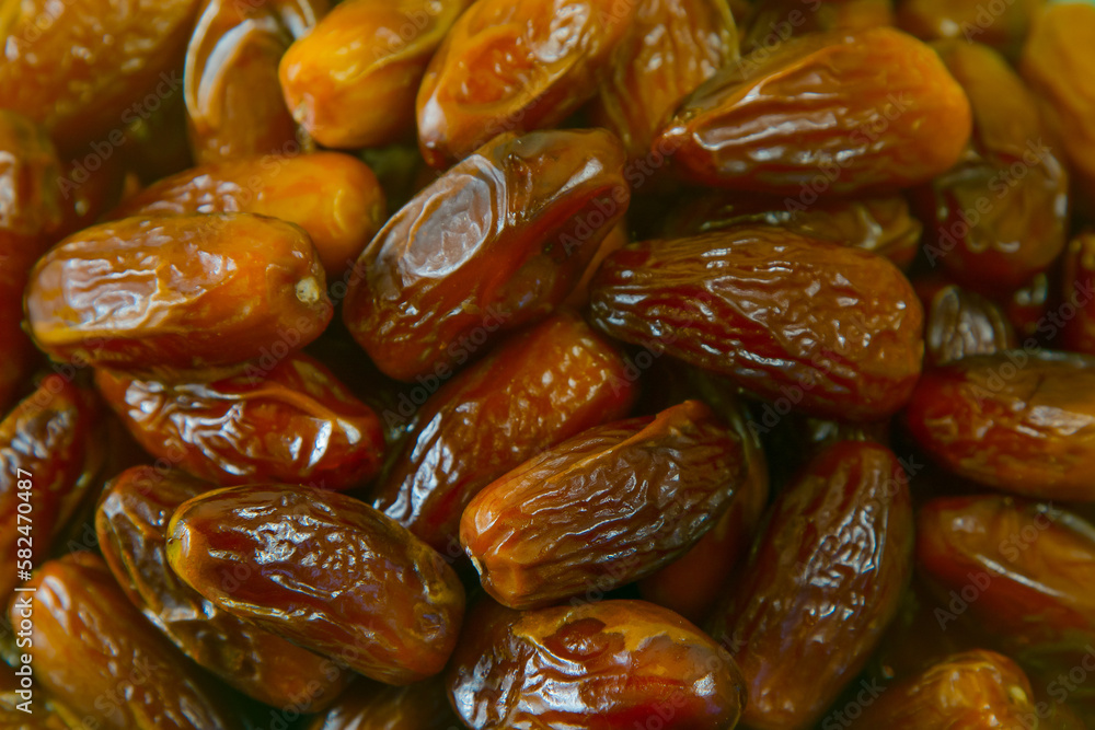 Dates. Dried date palm fruits. Healthy sweet snack food Pile of tasty dry dattes. Date harvest symbolizing Ramadan. Dates. Dried date palm fruits. Healthy sweet snack food Pile of tasty dry dattes. Date harvest symbolizing Ramadan.
