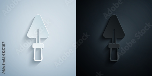 Paper cut Trowel icon isolated on grey and black background. Paper art style. Vector