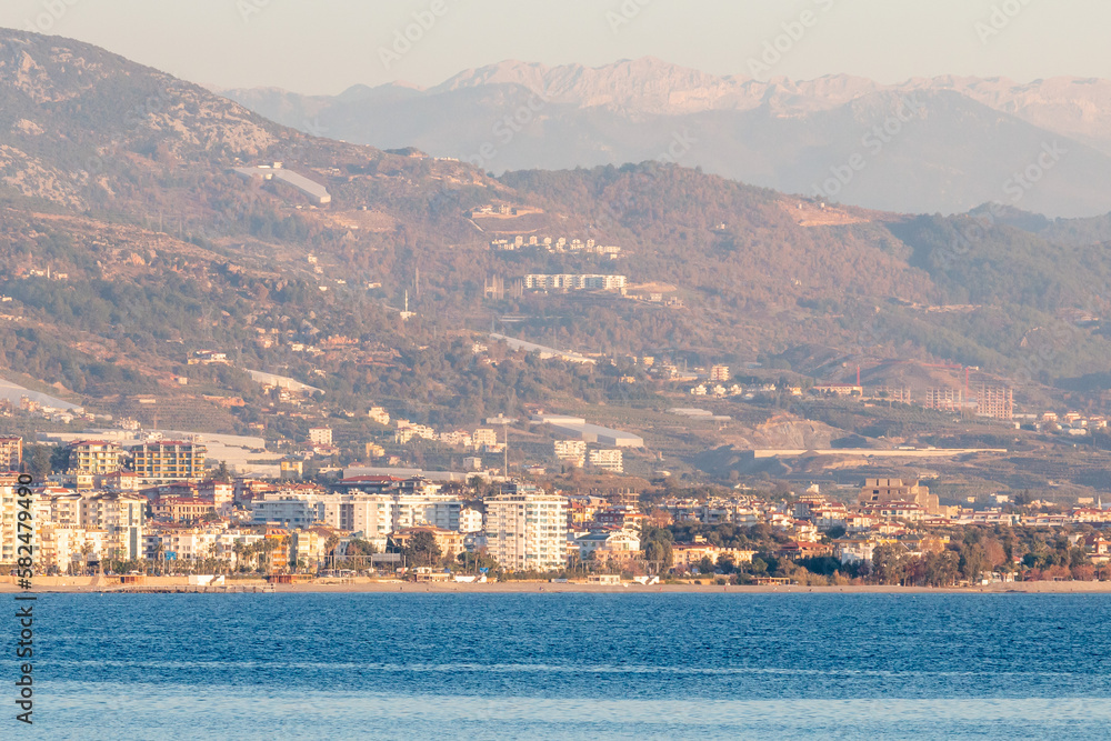 Panoramic view of Alanya and its surroundings with the Mediterranean Sea in the rays of the sunset