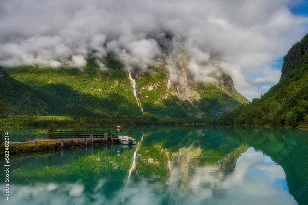 The place is called Kjenndalsstova, Turquoise lake Lovatnet and Kjenndalsbreen glacier, Norway	