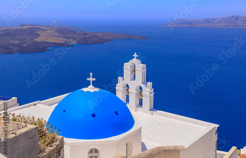TheThree Bells of Fira, a Greek Catholic church in Santorini, member of the Cyclades group of islands in Greece.